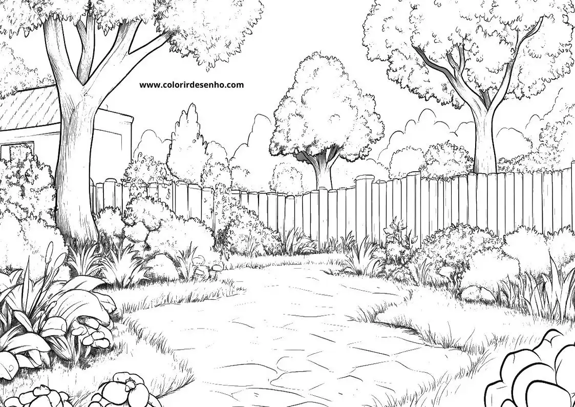garden path winding through trees and bushes in a fenced garden setting