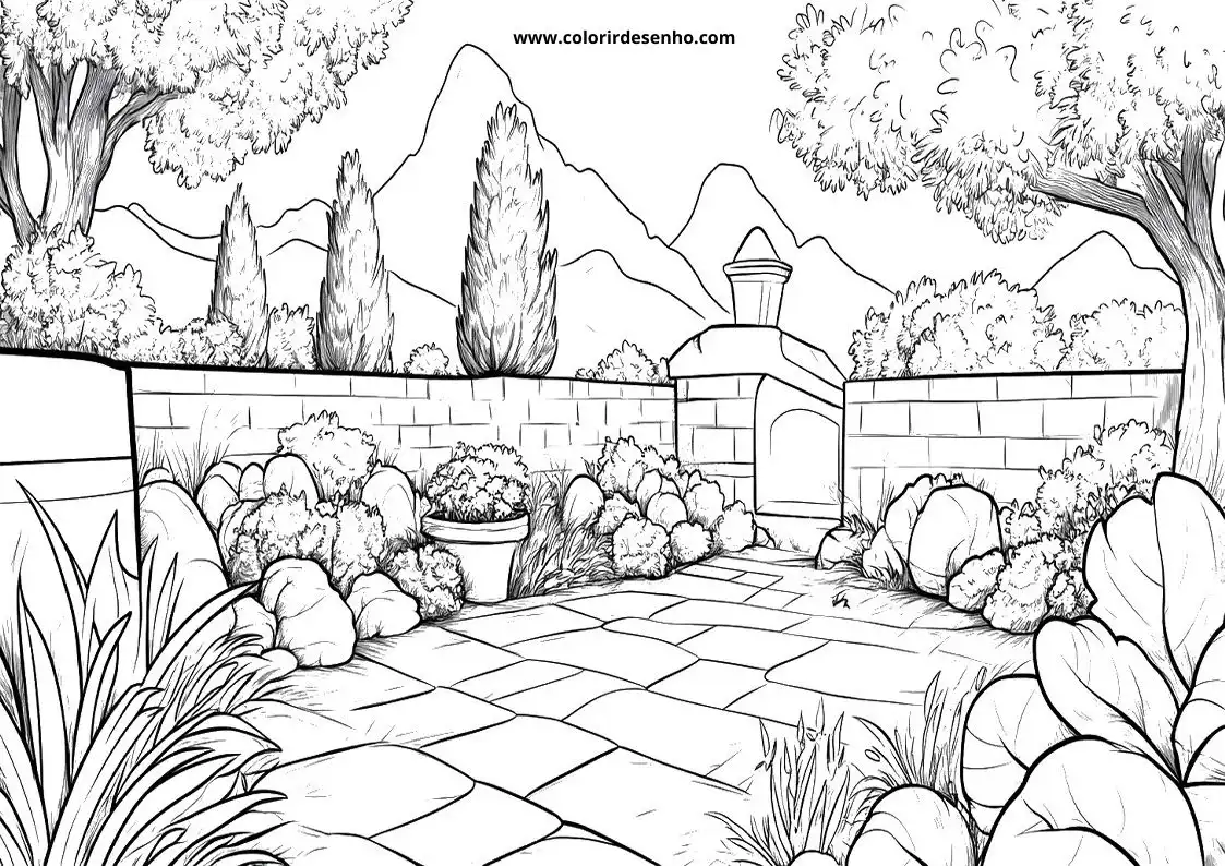 garden pathway winding through garden beds and trees with stone wall in the background