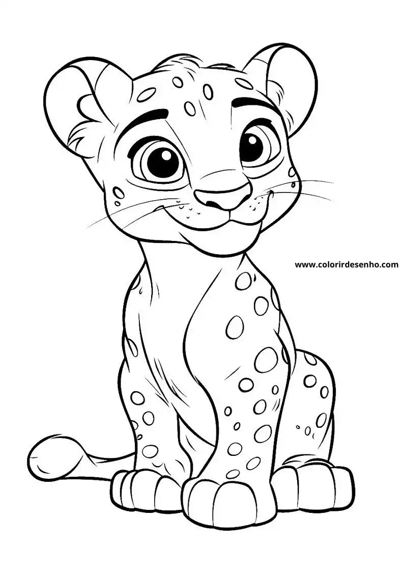 jaguar cub seated upright on all fours gazing playfully