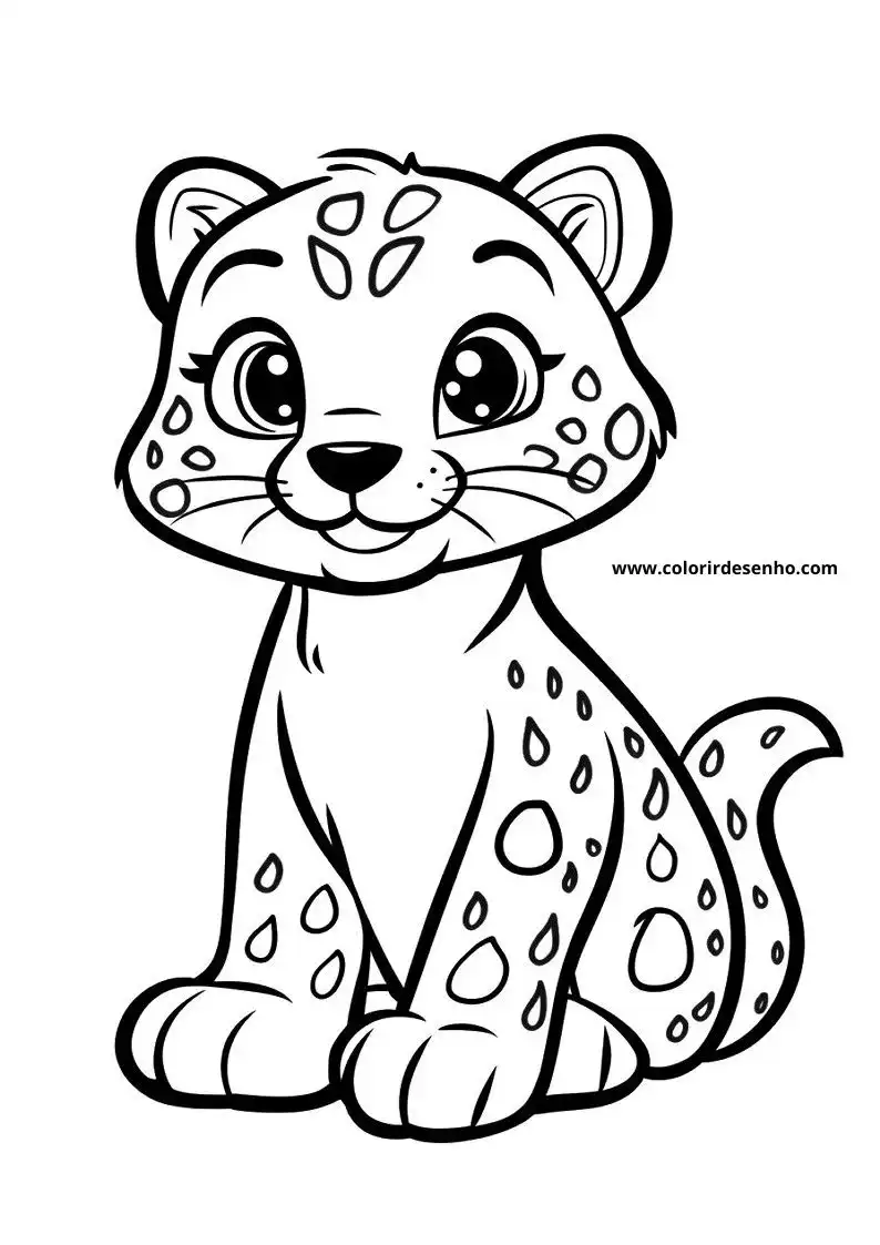 jaguar cub sitting upright on all fours with big eyes and spots visible