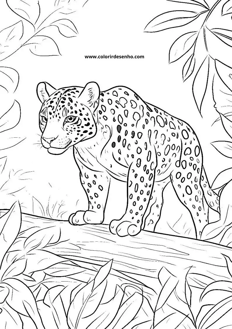 jaguar cub standing alertly in jungle setting with spotted fur and leafy background