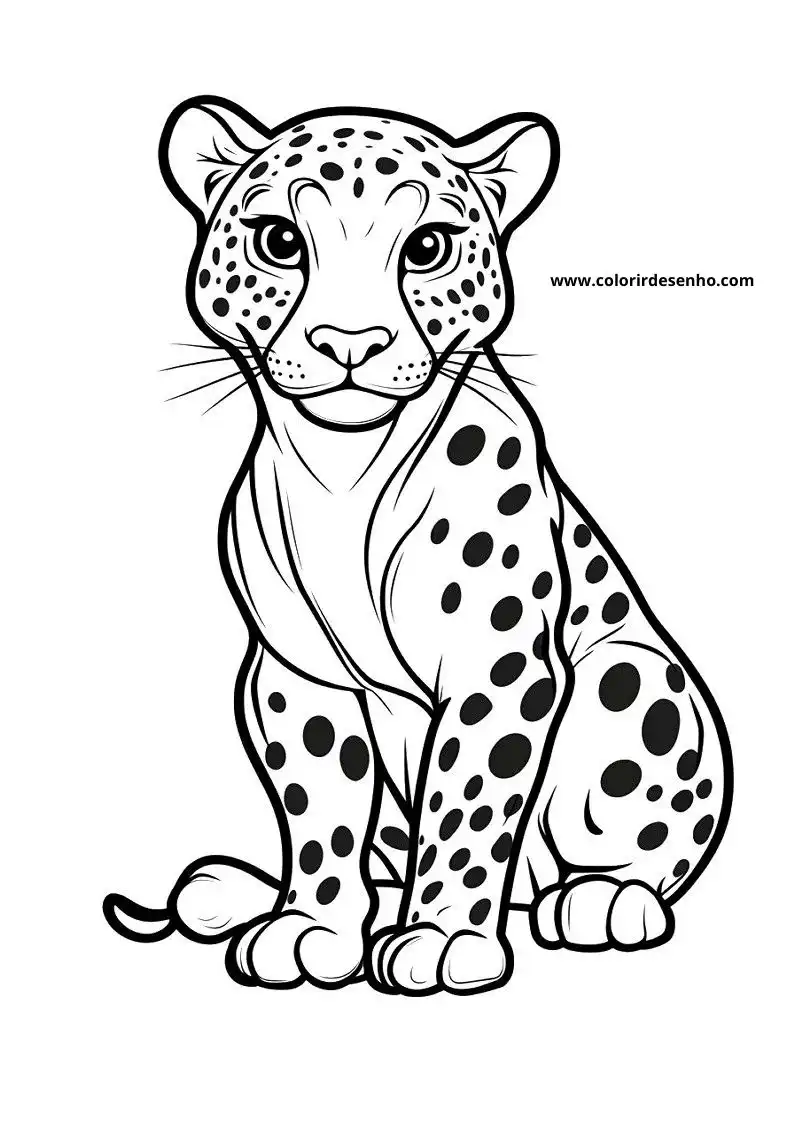 jaguar cub standing alertly with spotted fur looking around